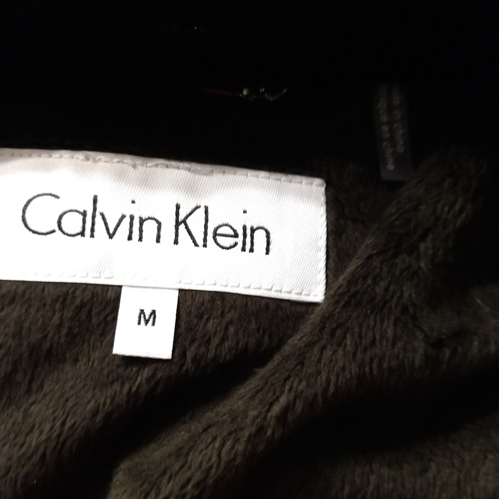 NWOT Calvin Klein puffer jacket with hood.